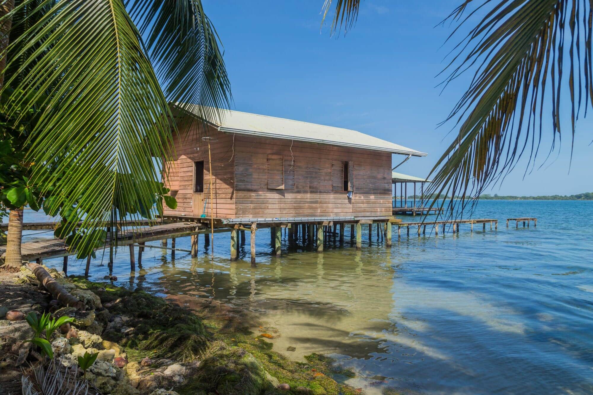 A typical Caribbean hut on stilts above the sea in Bocas del Toro, Panama