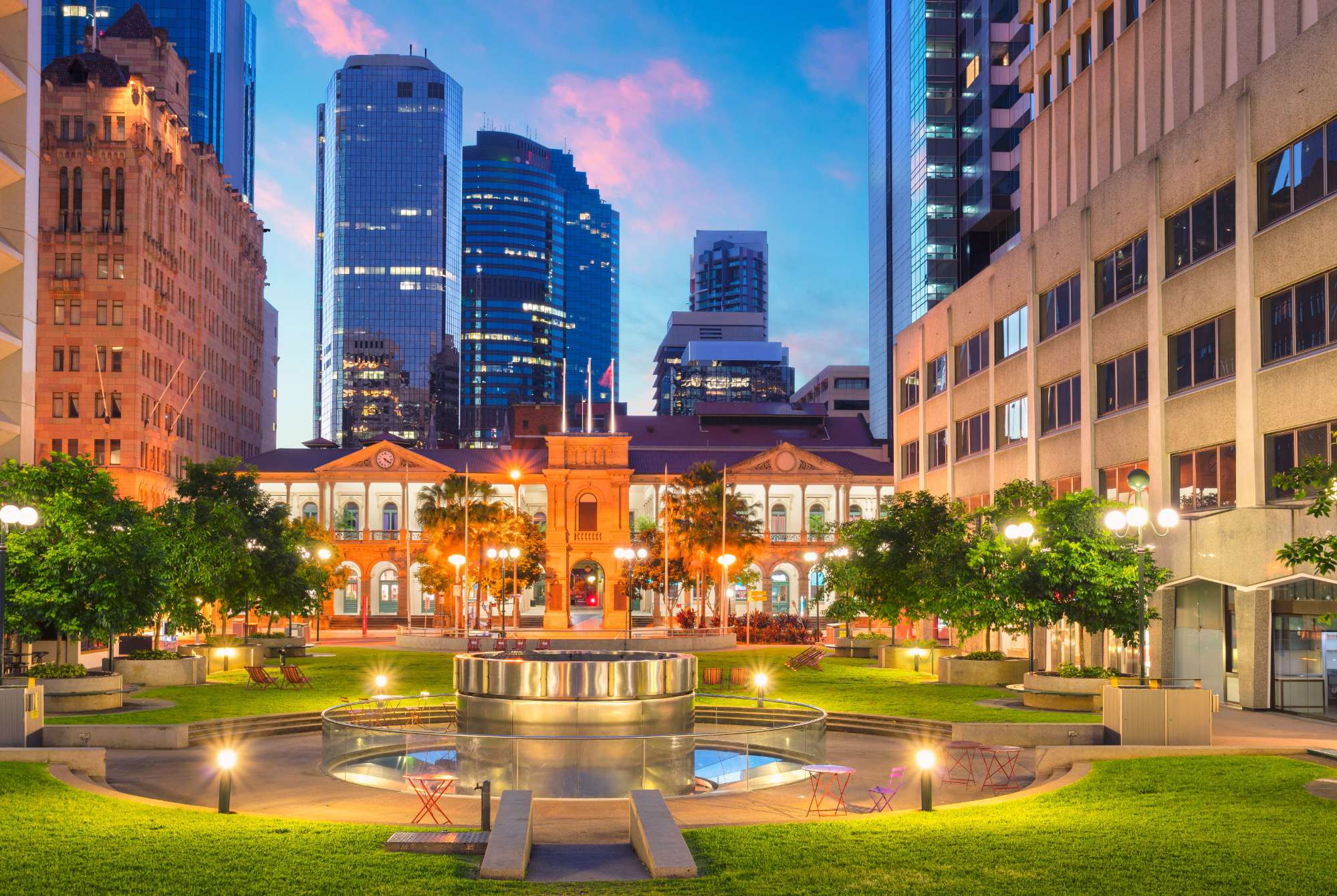 Civic Square in Brisbane Downtown - a lit up and bright space surrounded by tall buildings