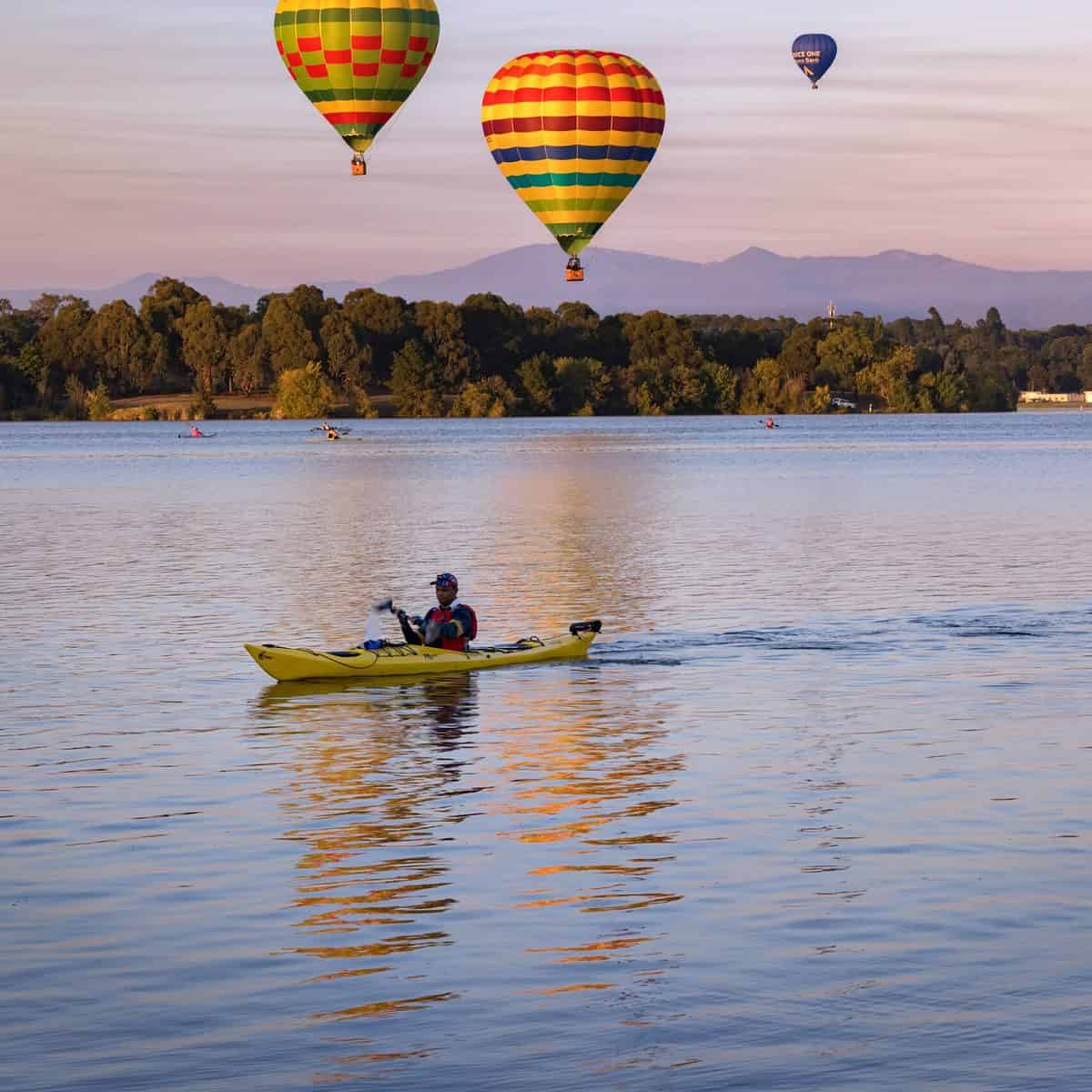 Colorful hot air balloons over Canberra's lakes