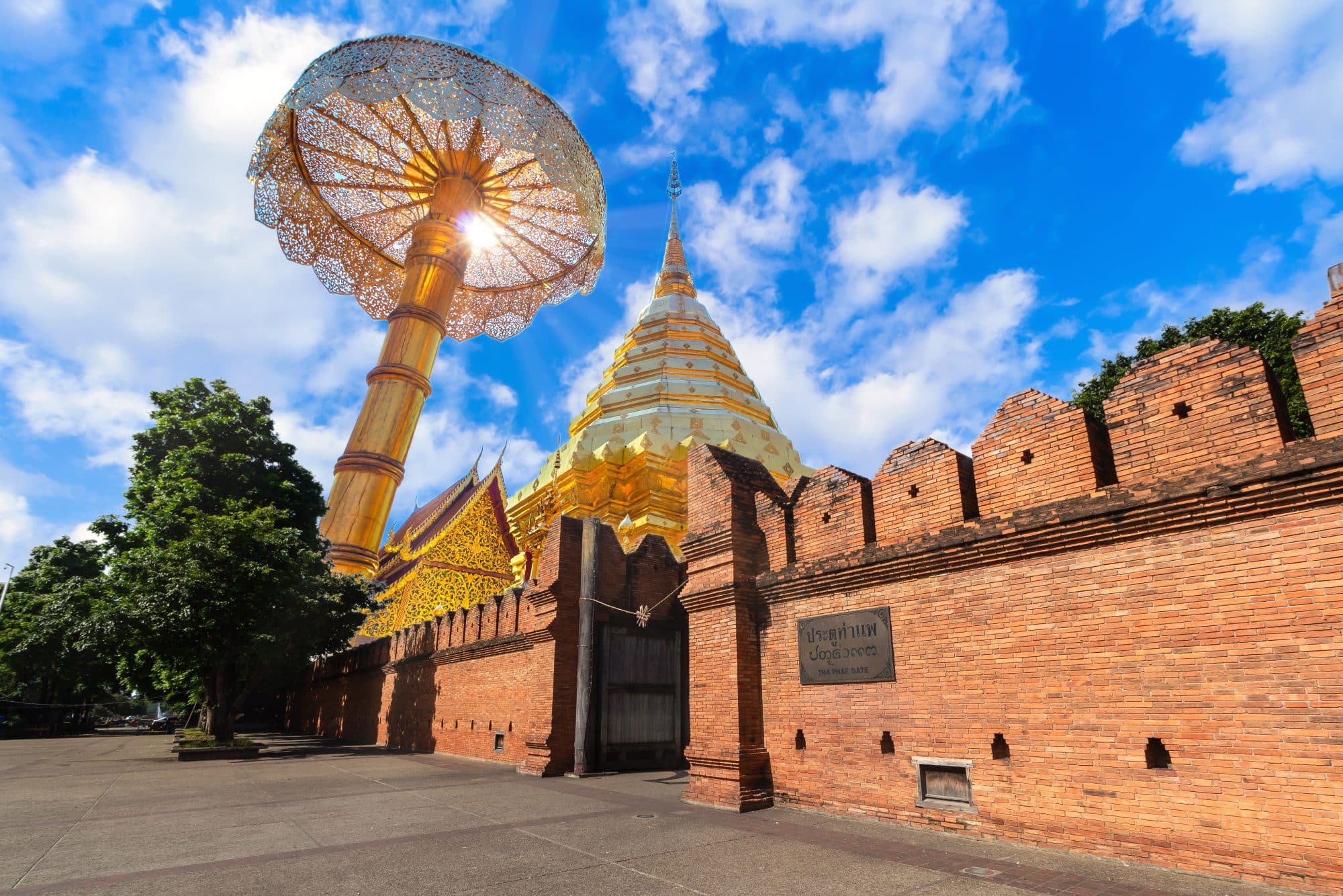 Tha Phae Gate Chiang Mai old town wall, moat and Wat Phra That Doi Suthep, a Buddhist temple in Chiang Mai, Thailand