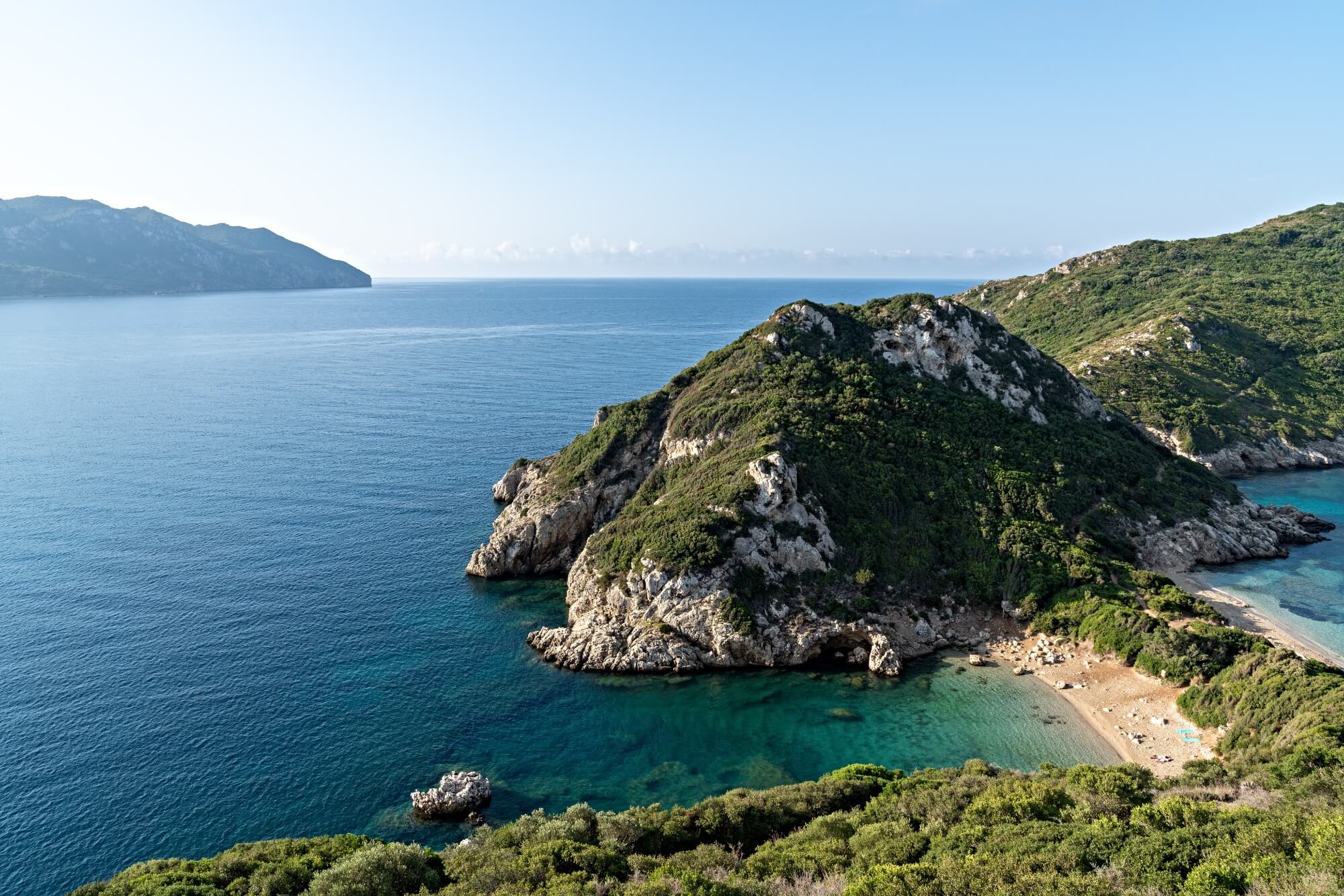 A narrow strip of land lined with sandy beaches on both side in Corfu