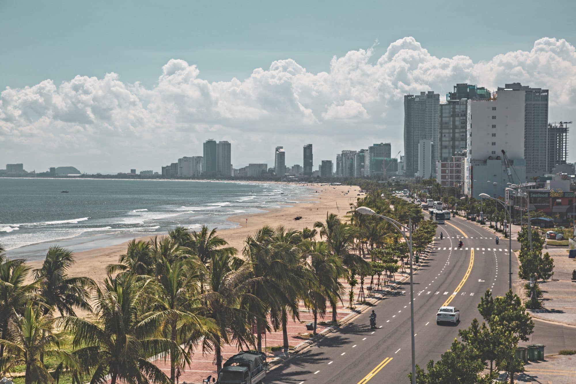 A palm-lined waterfront in the modern city of Da Nang in Vietnam