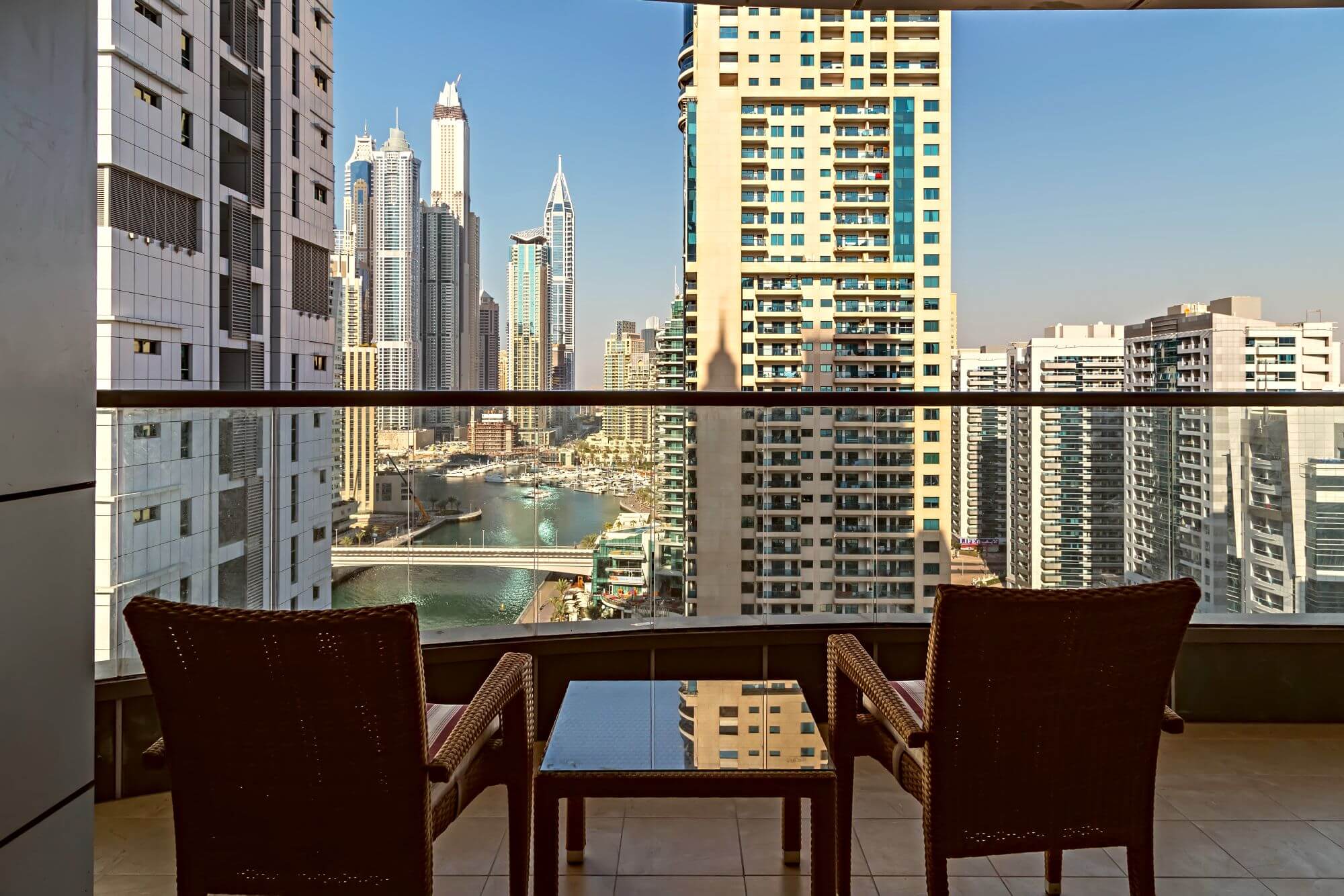 A view from a balcony of an apartment building located around Dubai Marina