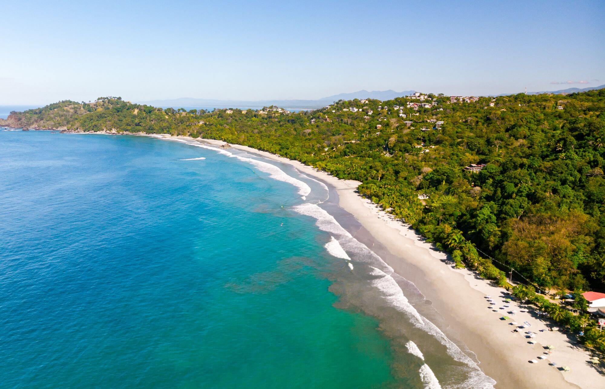 A long stretch of a beautiful tropical beach - drone view