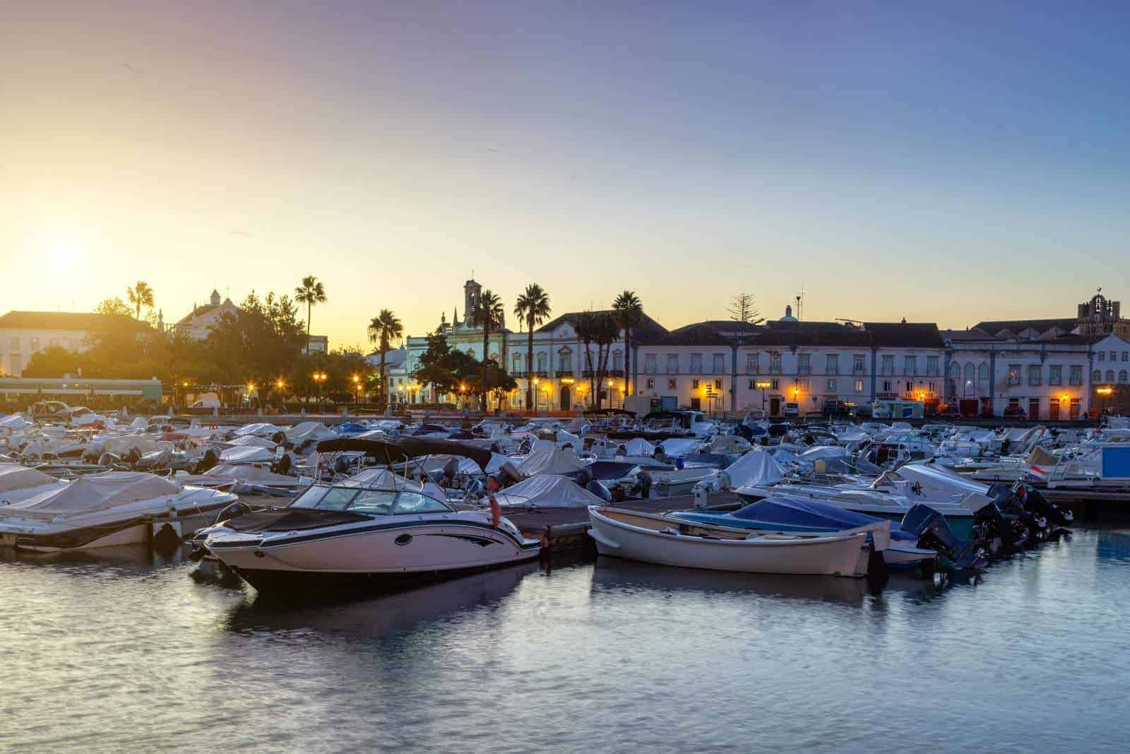 Sunrise above the matina full of moored boats and yachts