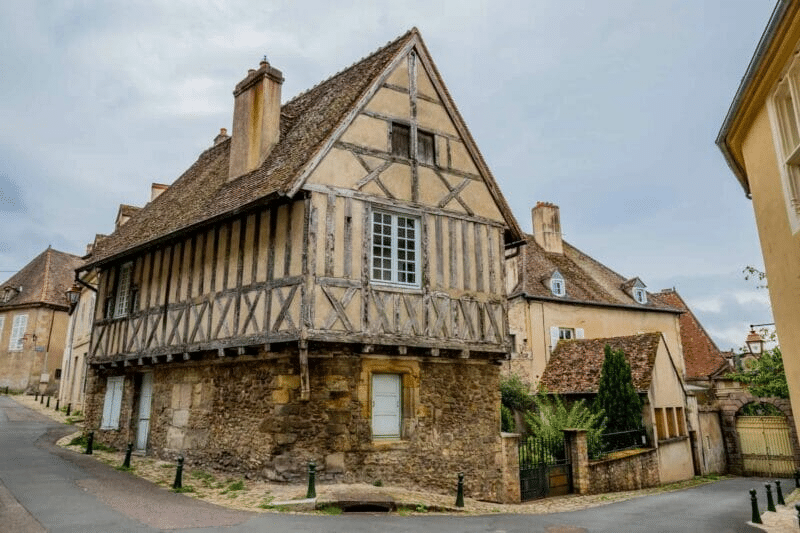 An old house with wooden beams and steep roof in Saône-et-Loire