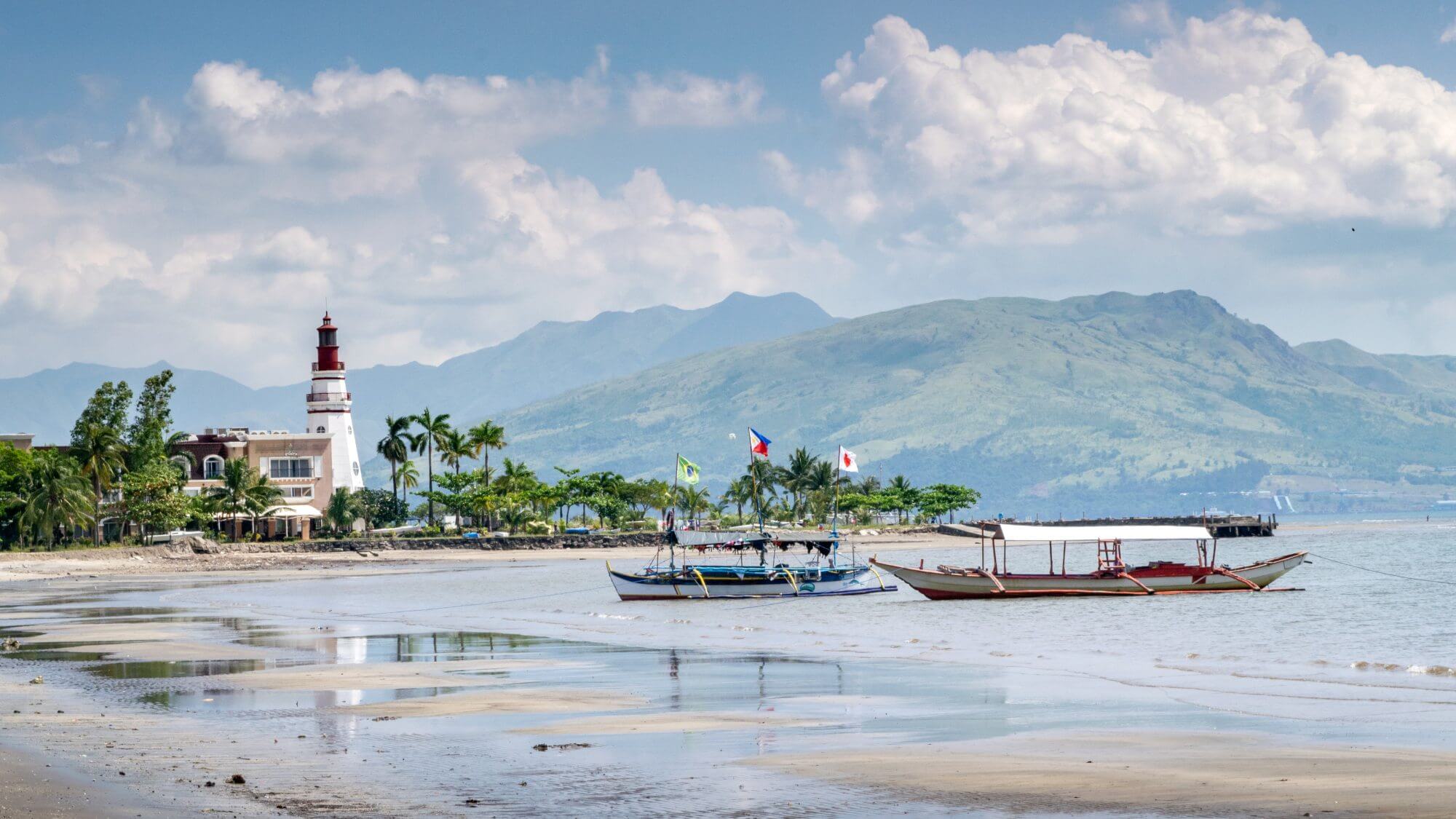 Subic Bay - a lighthouse and mountains in the background