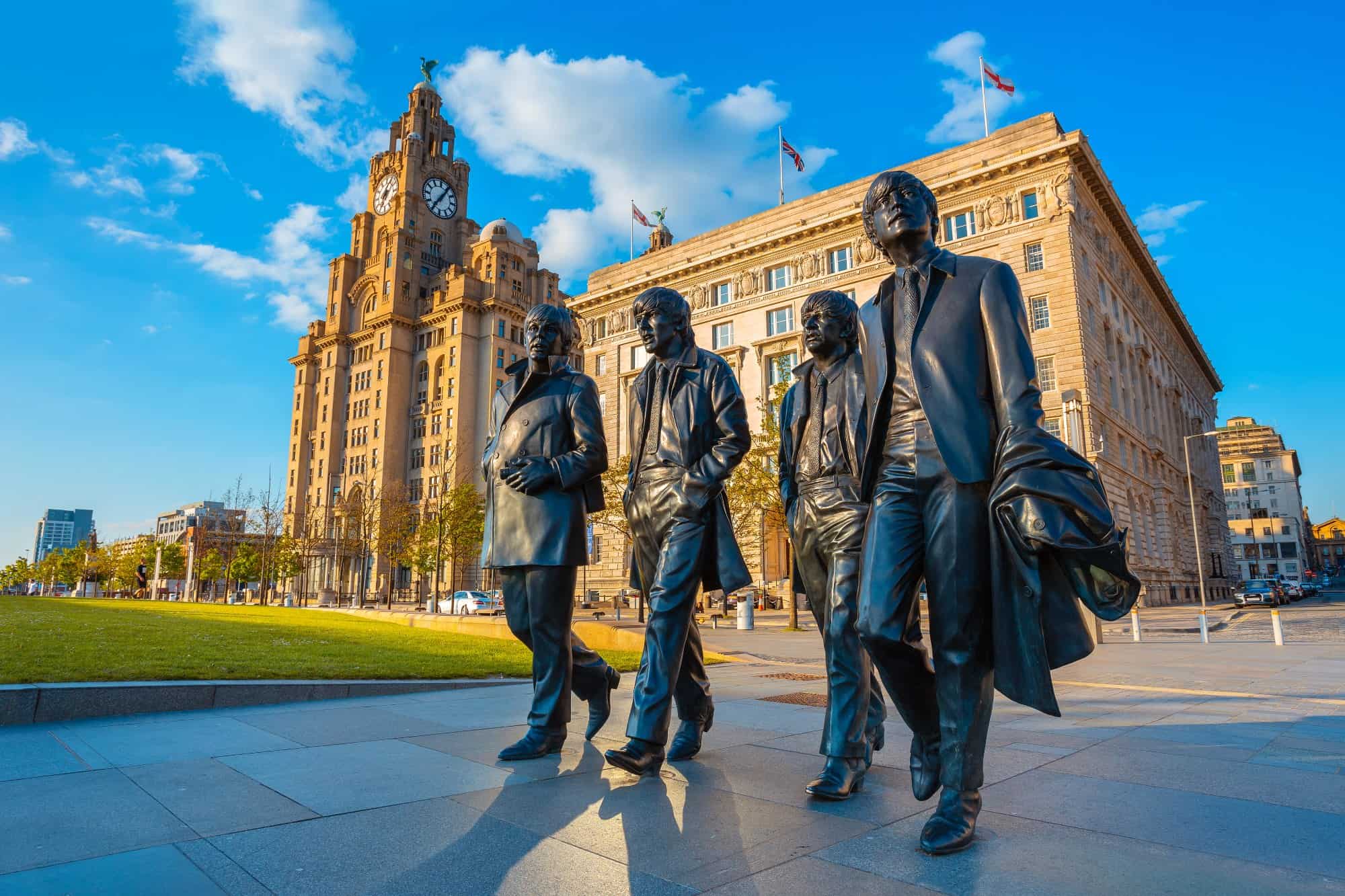 Bronze statue of the Beatles at the Pier Head on the side of River Mersey in Liverpool.