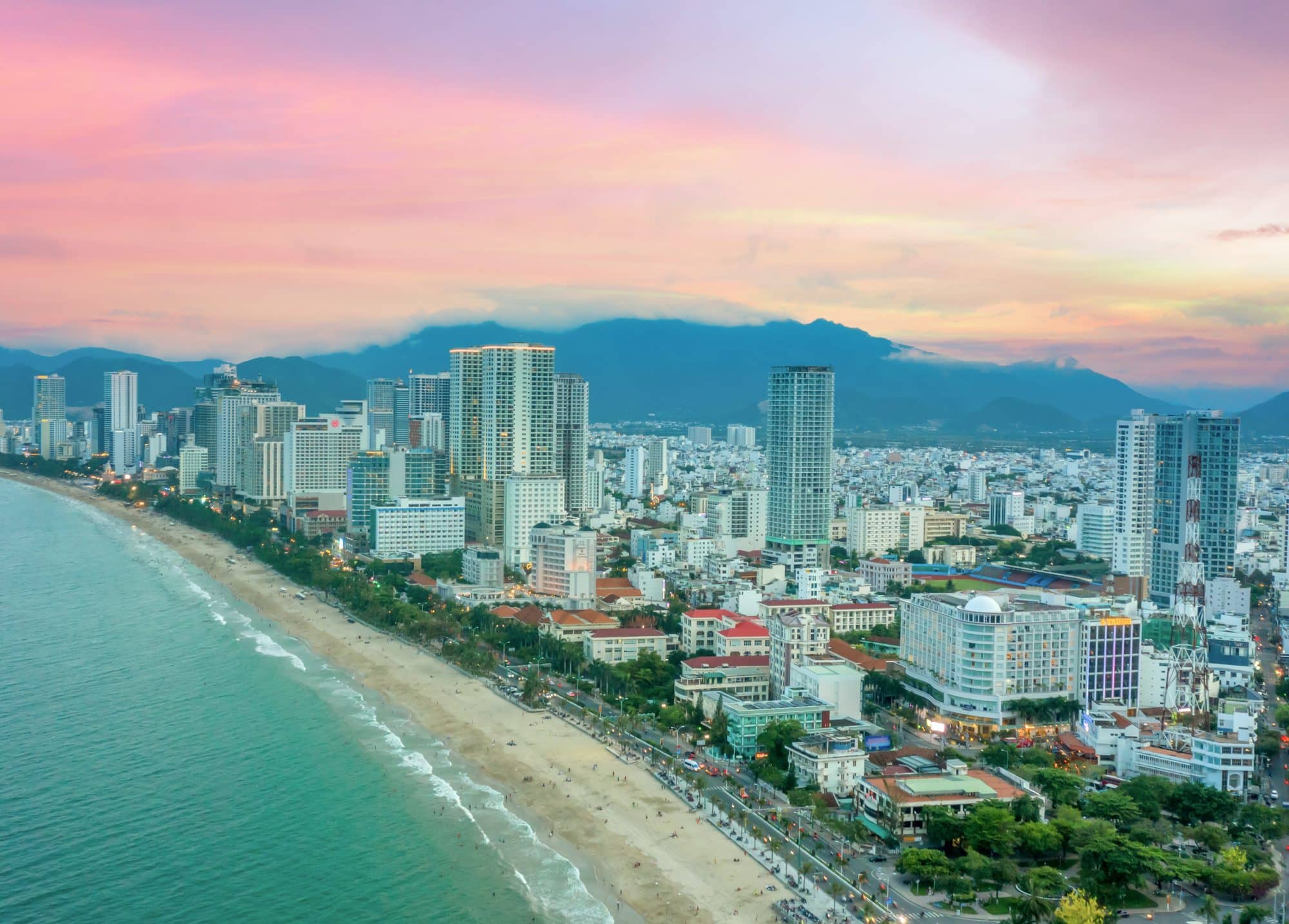 The coastal resort city of Nha Trang in southern Vietnam with its main beach curving along Tran Phu Street backed by a promenade, hotels and seafood restaurants.