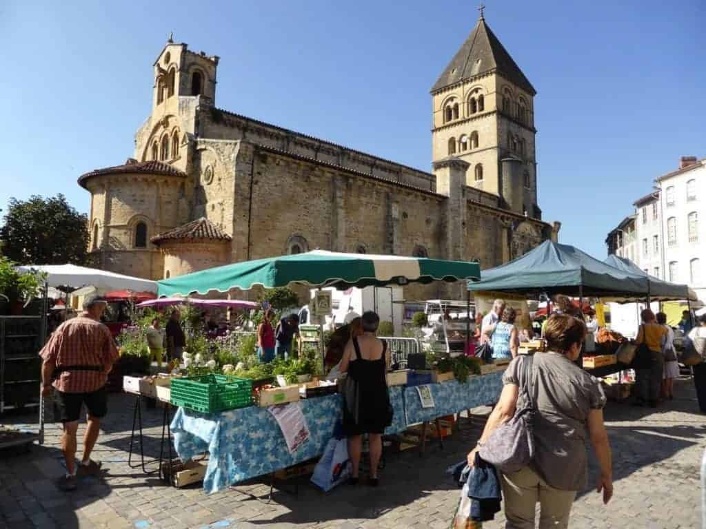 A little street market in Saint Gaudens, people buying vegetables and fruit from the street vendors
