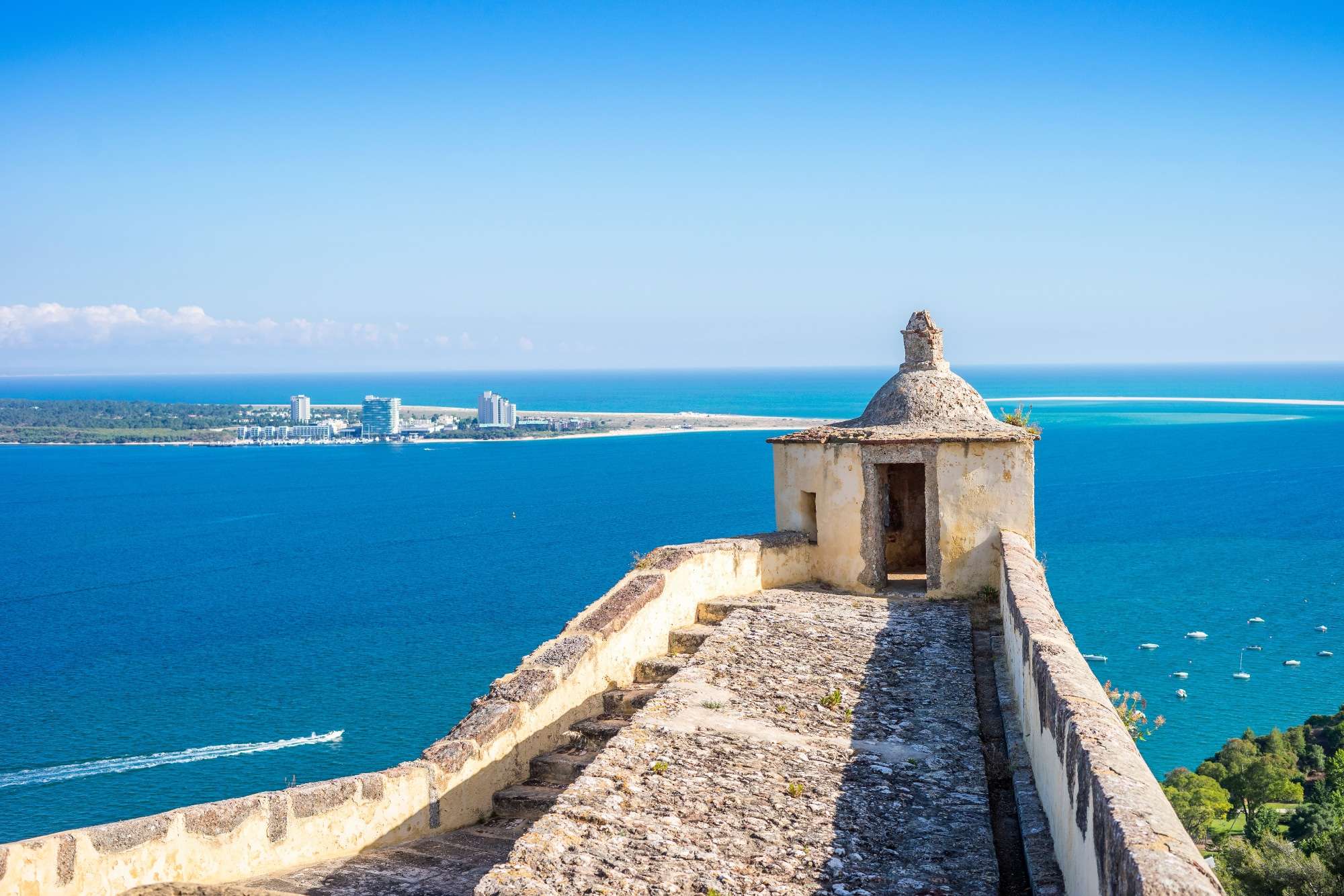 The Forte de Sao Filipe in Setubal and Troia city on the peninsula.