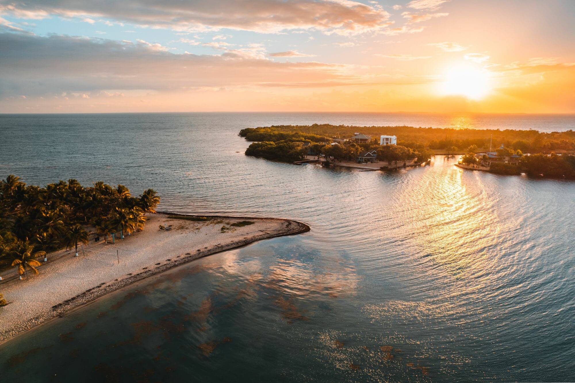 A sunset at the sea reflecting in the water in Belize