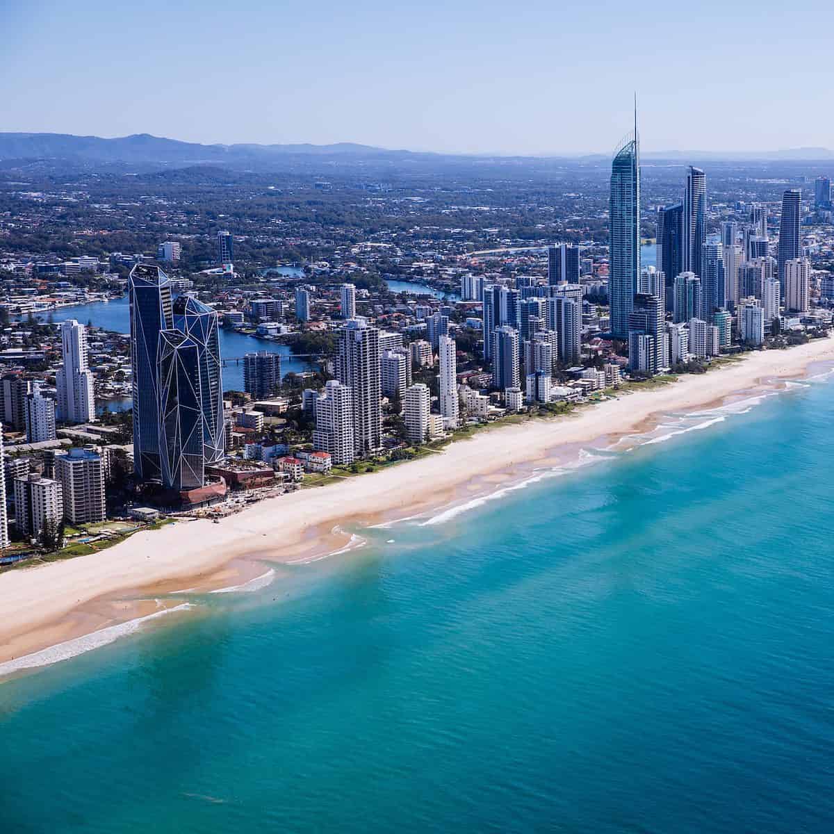 Surfers Paradise Beach - Gold Coast Australia - high rise buildings along the stretch of a sandy beach.